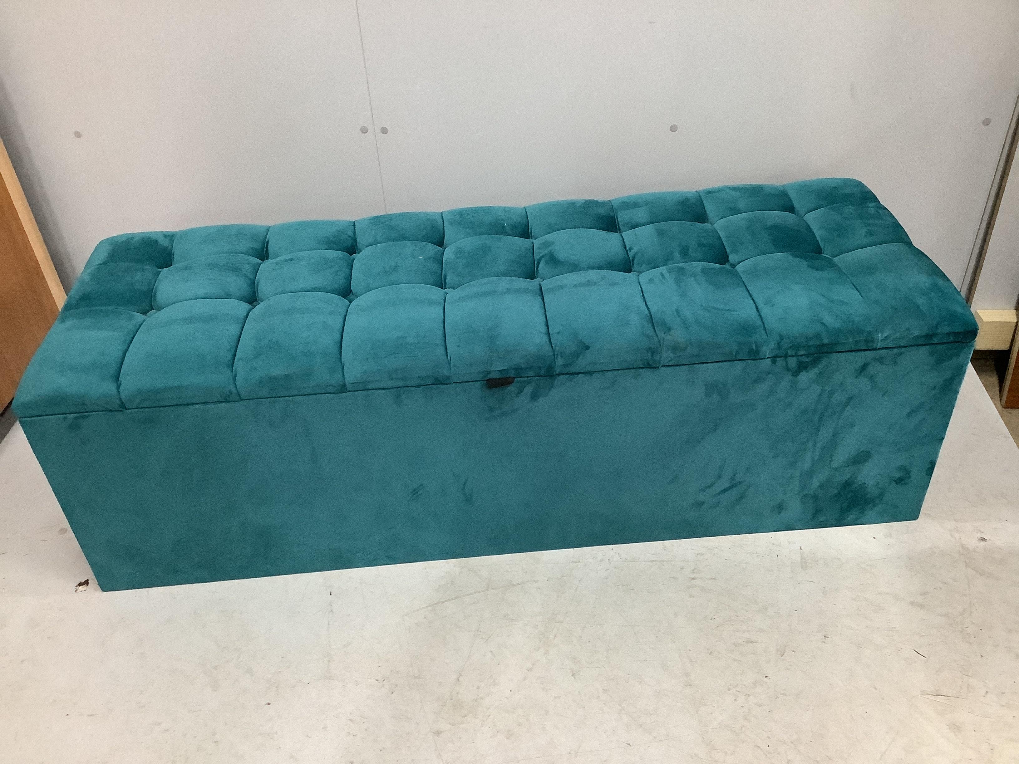 A modern upholstered ottoman, width 136cm, depth 46cm, height 42cm